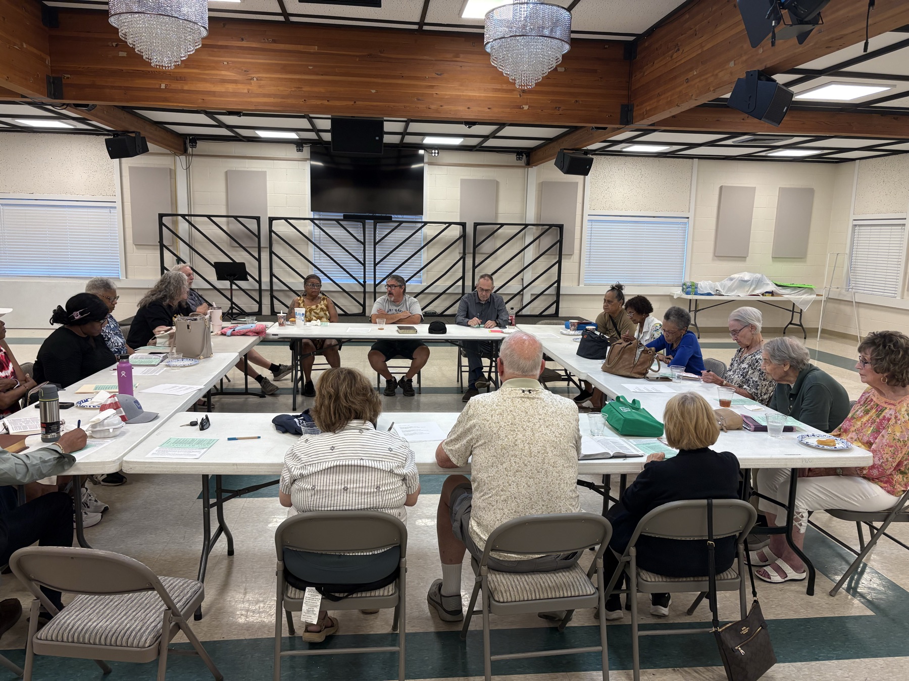 Bible Study group gathered around tables in the Fellowship Hall