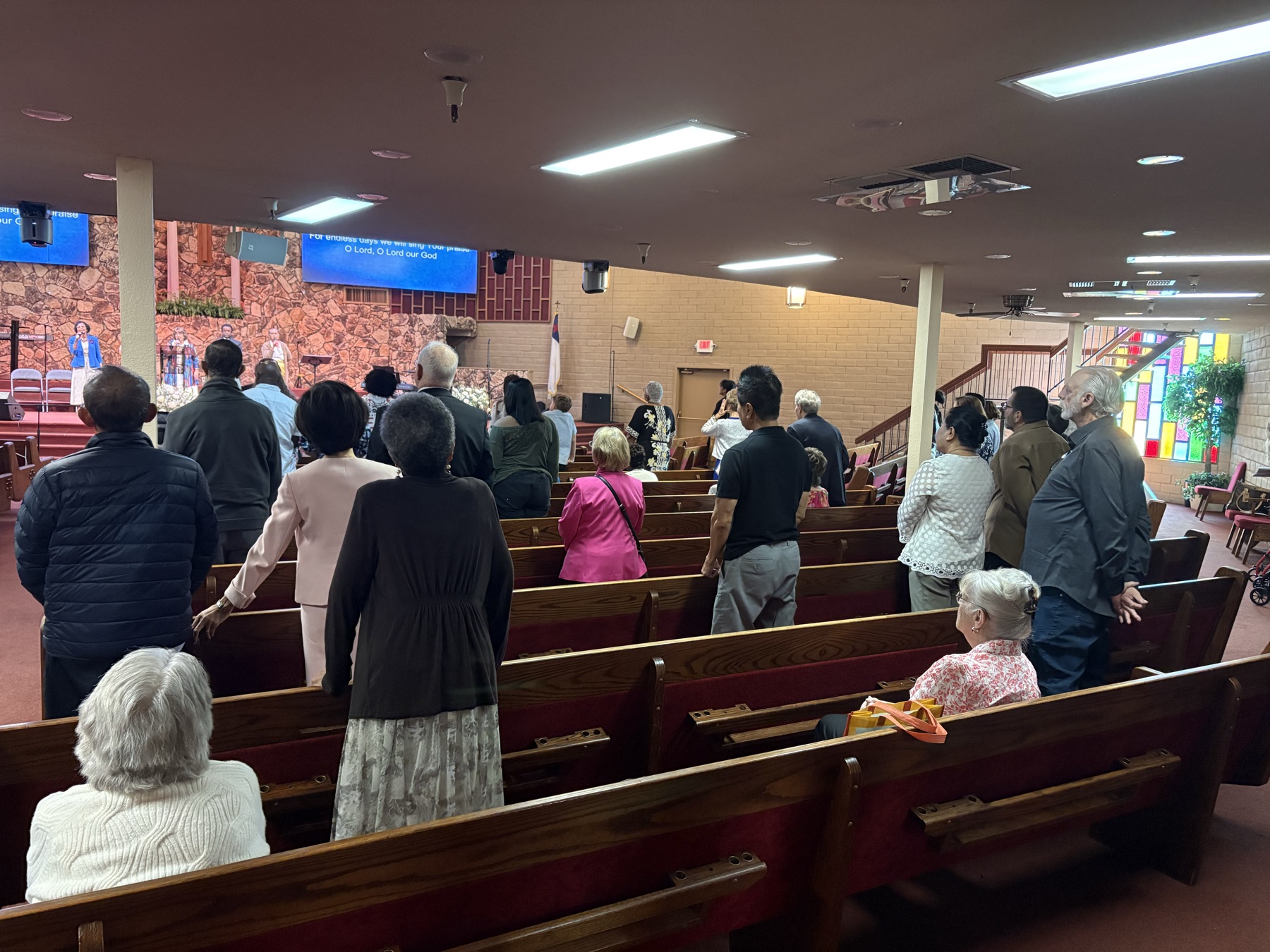 Congregation standing together in the sanctuary during worship