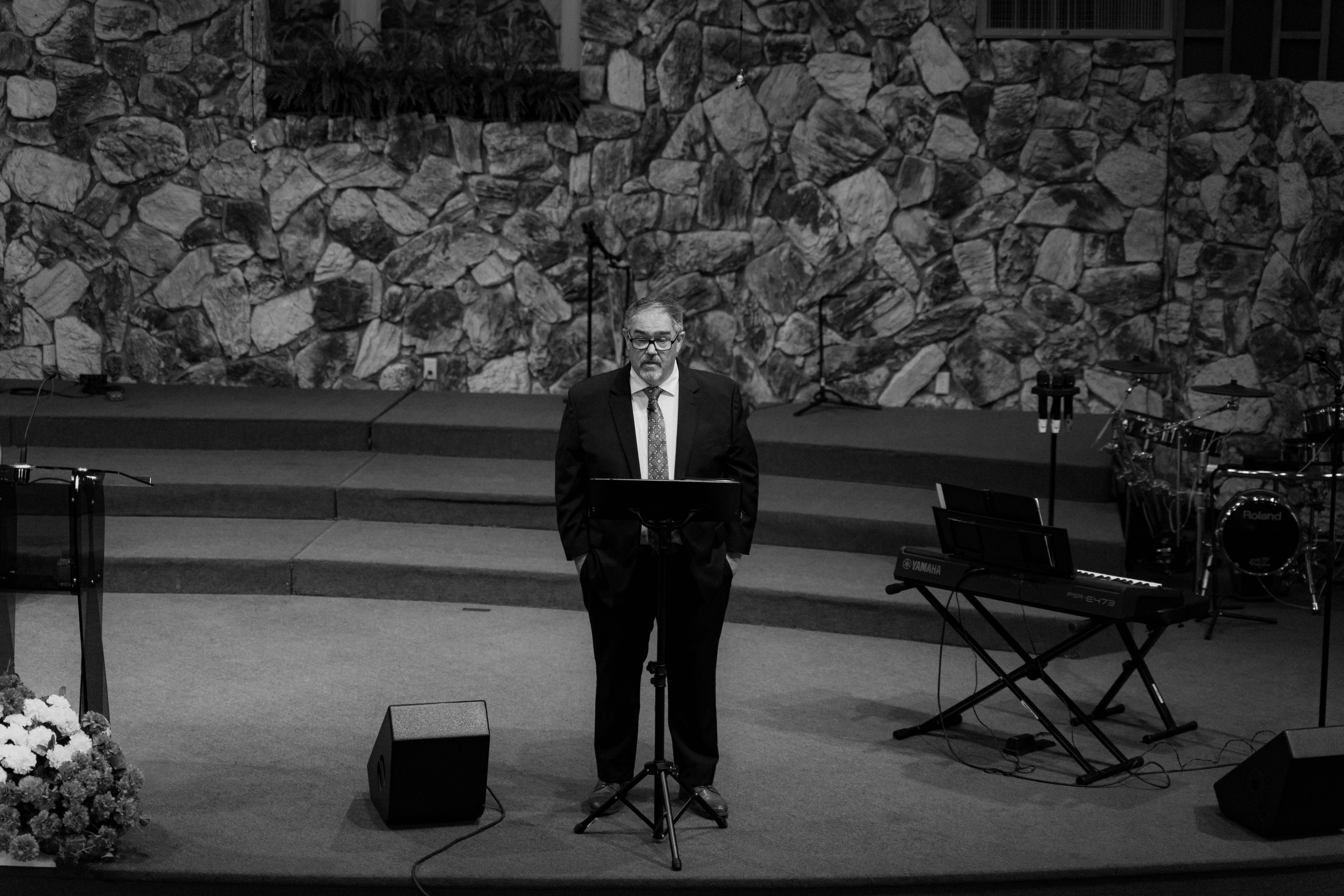 Pastor Tom Jones preaching from the pulpit
