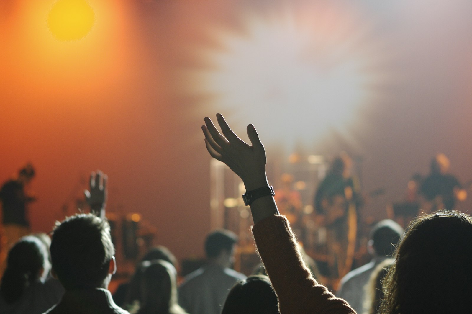 Congregation with hands raised in worship